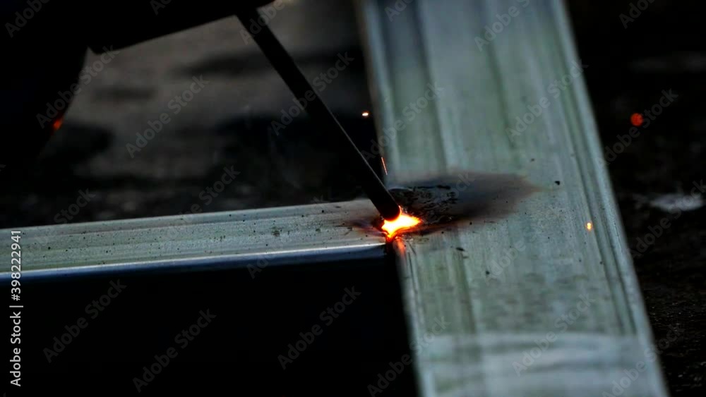The sparks flashed from welding. The sparks flashed from welding.