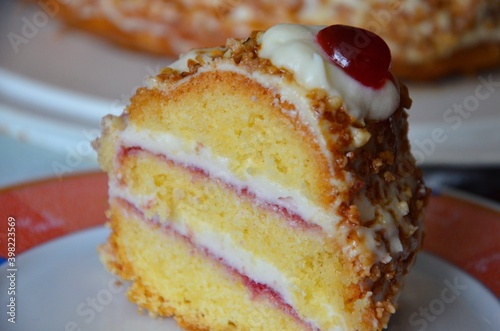 фотографія One piece of traditional german Frankfurter Kranz cake (Frankfurt Crown Cake), b