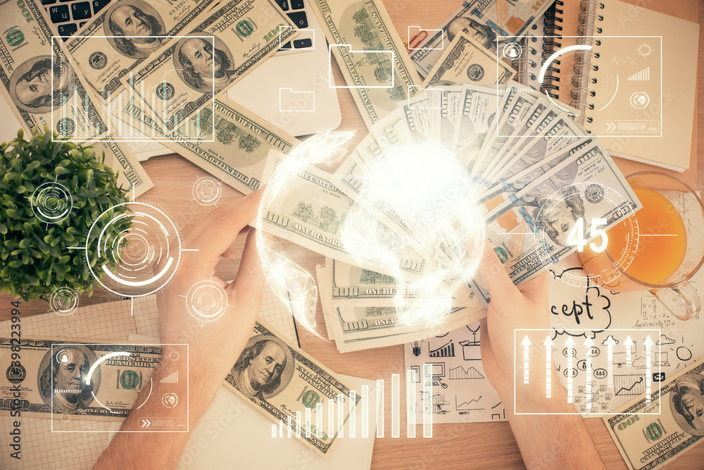 Multi exposure of financial graph drawing hologram and USA dollars bills and man hands. Analysis concept. Multi exposure of financial graph drawing hologram and USA dollars bills and man hands. Analysis concept.