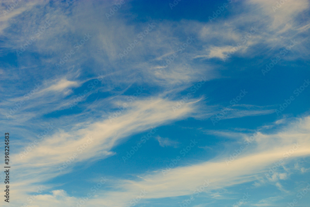 Beautiful blue sky background with tiny clouds