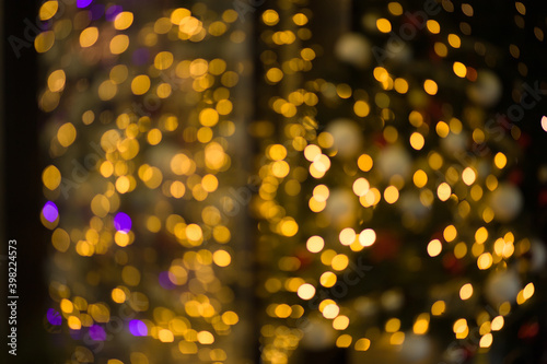 Golden abstract blurred defocused bokeh background. Abstract light background with light spots 