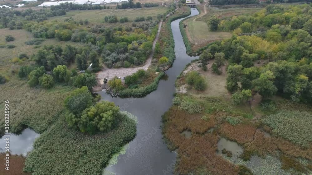 Aerial shot of a nice, narrow and curvy inflow of the Dnipro river in summer Aerial shot of a nice, narrow and curvy inflow of the Dnipro river in summer