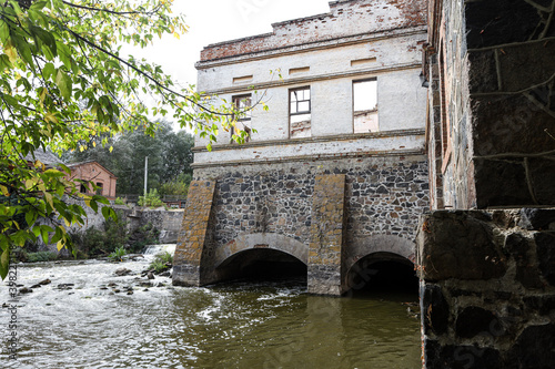 Fast water flows through an old hydroelectric power plant