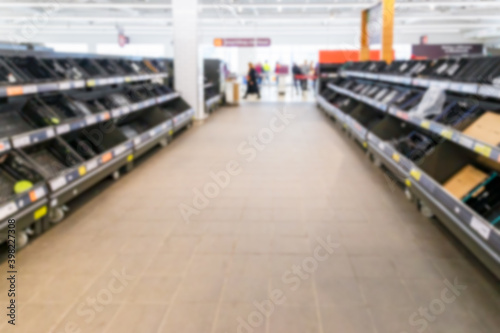 Blurred image of empty supermarket shelves due to Covid-19, Coronavirus, induced stockpiling