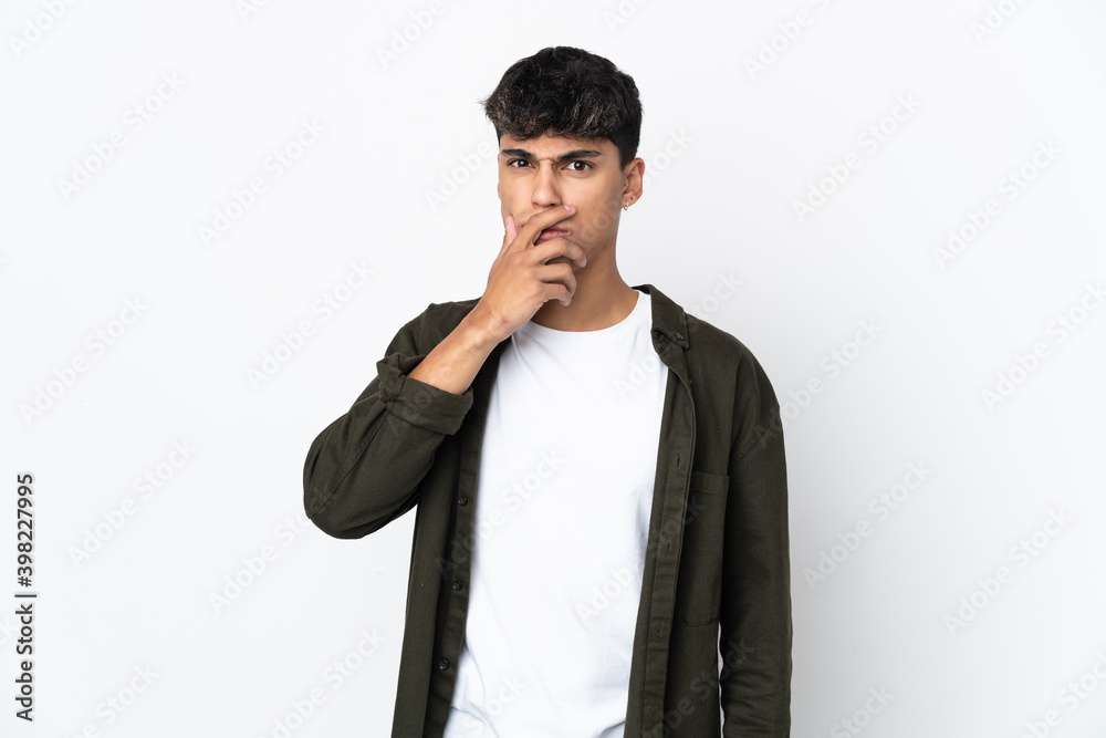 Young man over isolated white background surprised and shocked while looking right Young man over isolated white background surprised and shocked while looking right