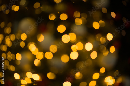 Golden abstract blurred defocused bokeh background. Abstract light background with light spots 