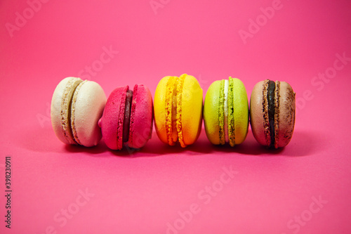 colorful macaroons on a pink background