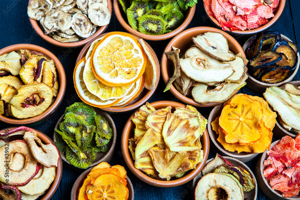 Organic Healthy Assorted Dried Fruit Mix close up. Dried fruit snacks. dried apples, mango, feijoa, dried apricots, prunes top view Organic Healthy Assorted Dried Fruit Mix close up. Dried fruit snacks. dried apples, mango, feijoa, dried apricots, prunes top view
