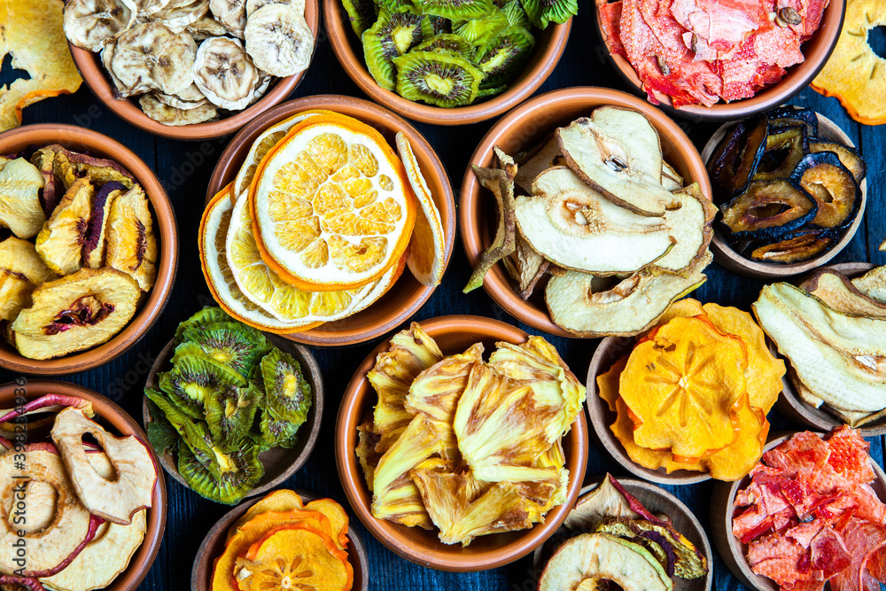 Organic Healthy Assorted Dried Fruit Mix close up. Dried fruit snacks. dried apples, mango, feijoa, dried apricots, prunes top view Organic Healthy Assorted Dried Fruit Mix close up. Dried fruit snacks. dried apples, mango, feijoa, dried apricots, prunes top view