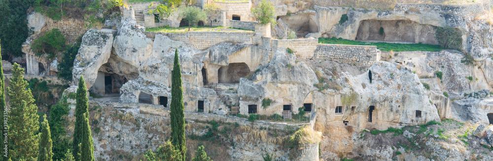 cave dwelling in valley of Gravina di Puglia, Italy. Panorama view