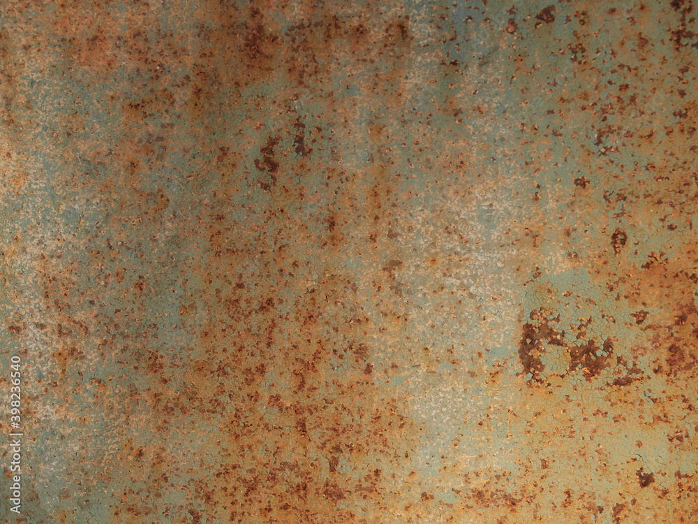 Rust.Old blue painted wall with rust spots.Textured rusty metal background. Rust stains through the cracked blue paint. Rust.Old blue painted wall with rust spots.Textured rusty metal background. Rust stains through the cracked blue paint.