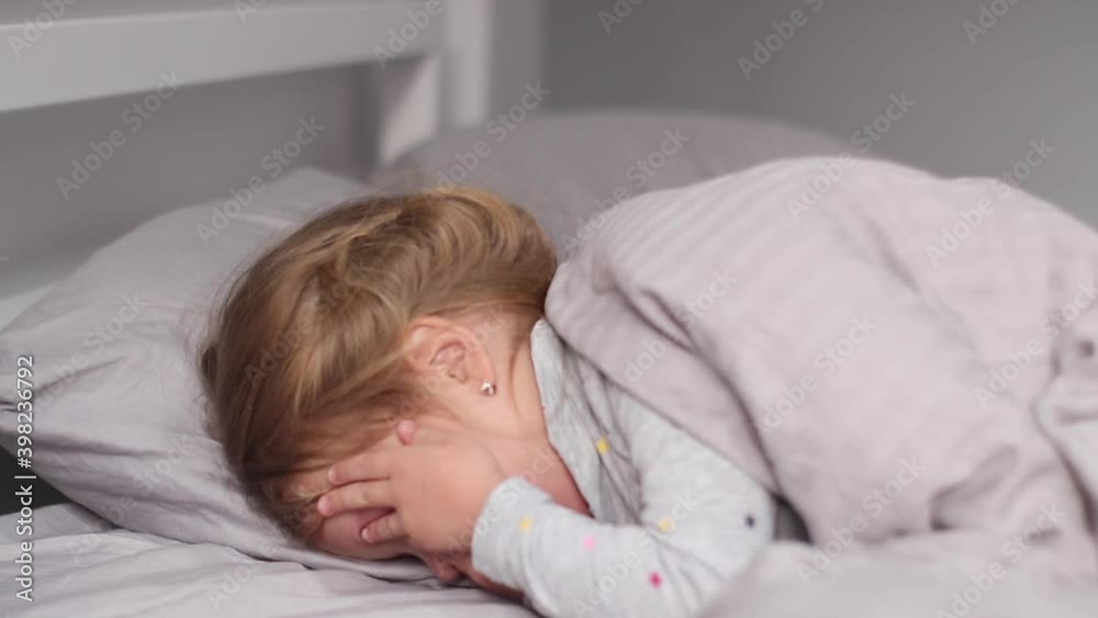 charming little girl having fun, laughing in gray room. morning routine, childhood, daughter. FullHD footage charming little girl having fun, laughing in gray room. morning routine, childhood, daughter. FullHD footage
