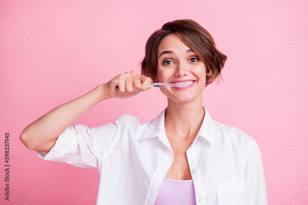 Photo of adorable cheerful young lady wear white shirt cleaning teeth toothbrush isolated pink color background Photo of adorable cheerful young lady wear white shirt cleaning teeth toothbrush isolated pink color background
