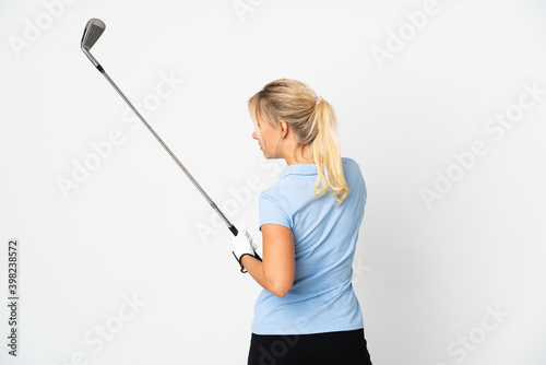 Young Russian woman isolated on white background playing golf