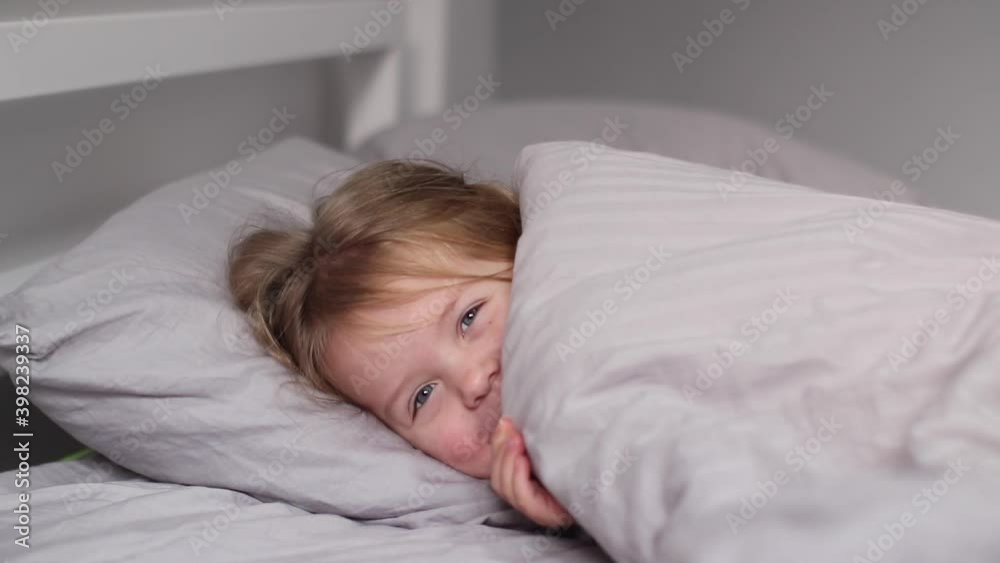 charming little girl having fun, laughing in gray room. morning routine, childhood, daughter. FullHD footage charming little girl having fun, laughing in gray room. morning routine, childhood, daughter. FullHD footage