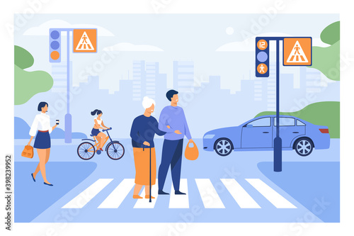 Young man helping old woman crossing road flat vector illustration. Cartoon elderly walking town crosswalk with help of guy. Urban lifestyle and cityscape concept
