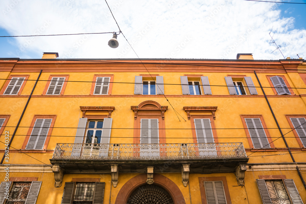 Εκτύπωση καμβά colorful apartments with shutters in street Via Emilia