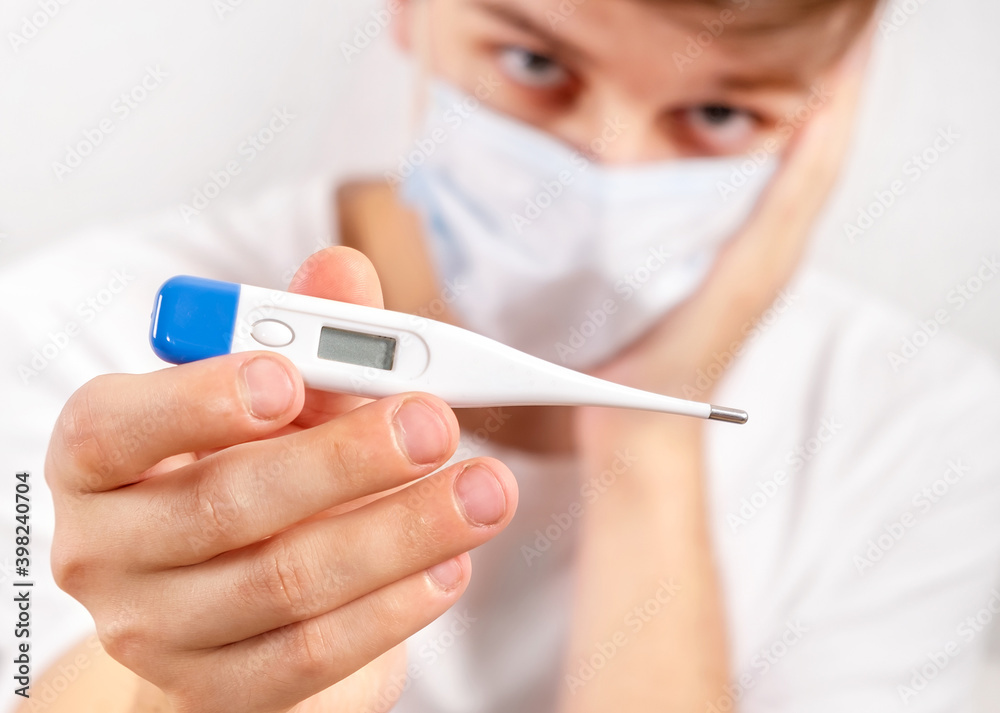 Young Man with a Thermometer Young Man with a Thermometer