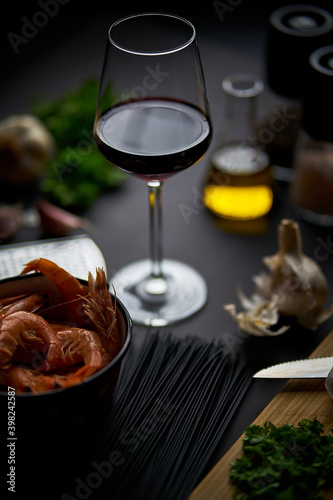 black shrimp table with wine noodles and spices