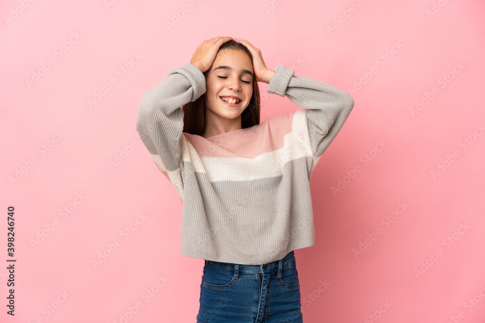 Little girl isolated on pink background laughing