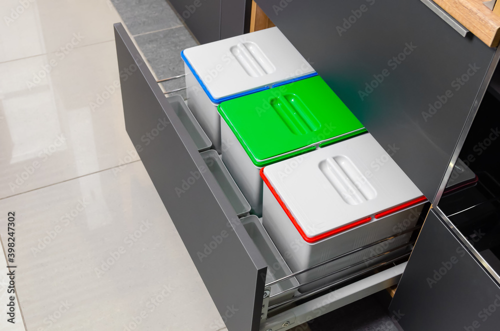 Three garbage containers for sorting garbage in the kitchen
