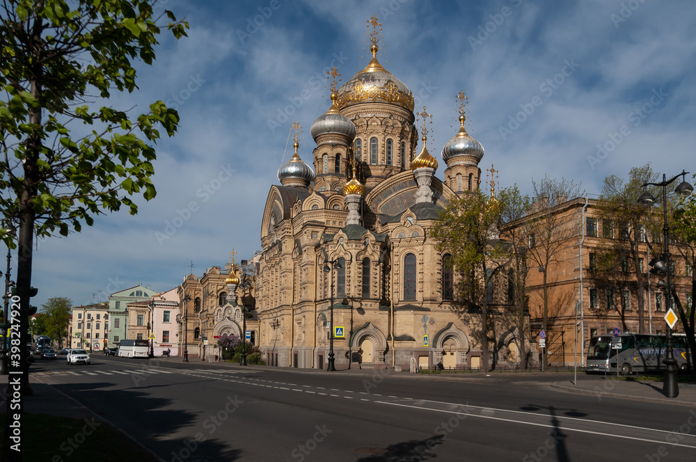 The magnificent carved temple of the Dormition of the Mother of God on Vasilievsky Island in the morning sun. Silver - gold domes, Pseudo Russian style. St Petersburg, Russia.