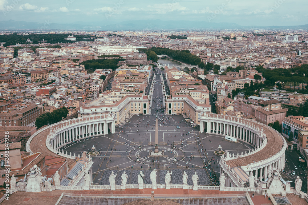Panoramic view on the St. Peter's square and city of Rome from Papal Basilica