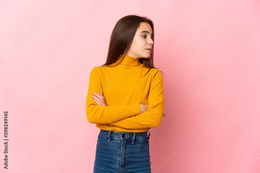 Little girl isolated on pink background keeping the arms crossed Little girl isolated on pink background keeping the arms crossed