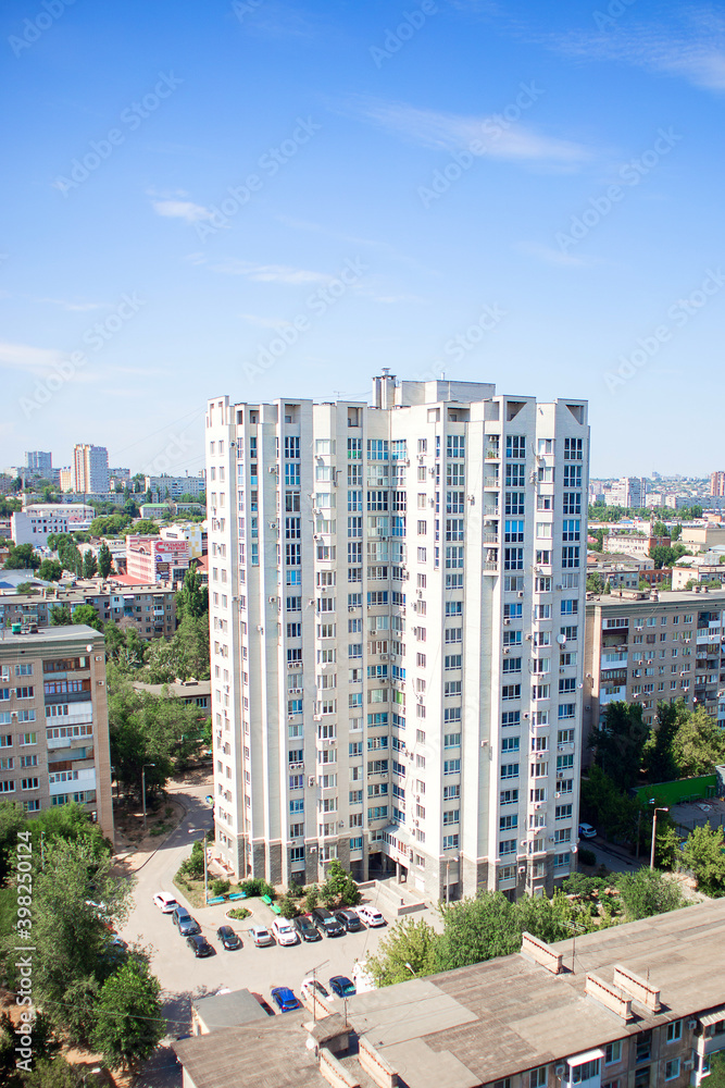 Obraz premium Russia, Volgograd, 07.13.2020: High multi-storey modern residential building. View from a height of the residential complex