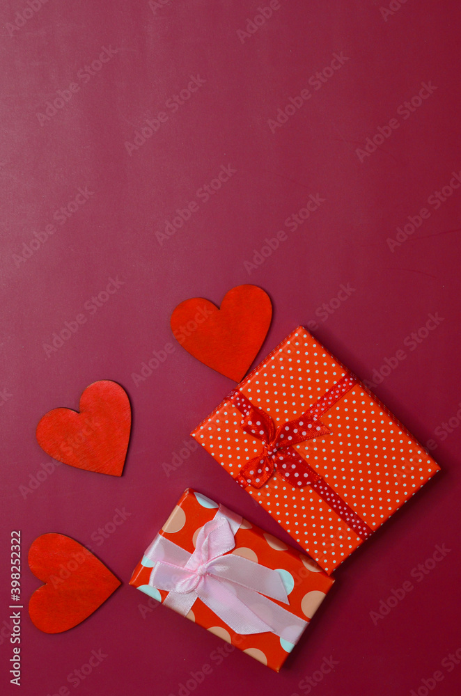 Obraz premium Holiday greeting card for Valentine's day and wooden decor in the shape of a red heart top view gift box, holiday concept, birthday, mother's day women's day, march 8