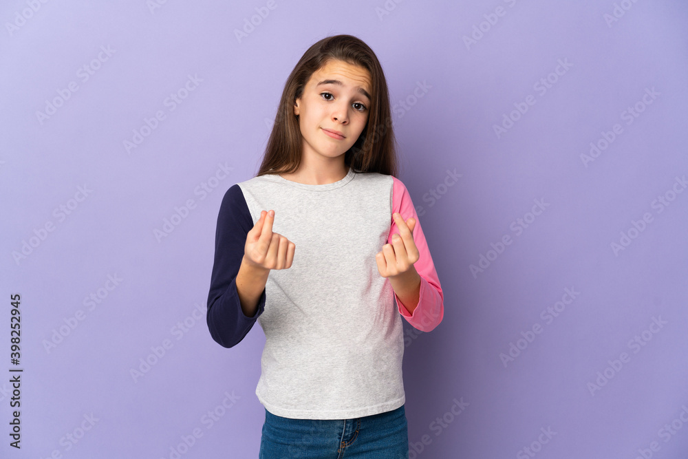 Little girl isolated on purple background making money gesture but is ruined Little girl isolated on purple background making money gesture but is ruined