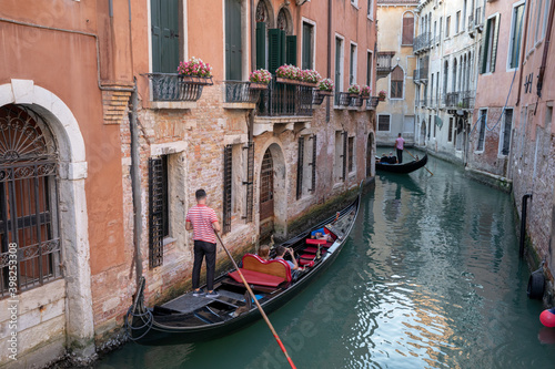 Panoramic view of Venice canal with historical buildings and gondolas