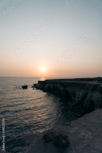 Sunset view on the sea shore and cliffs in Cyprus