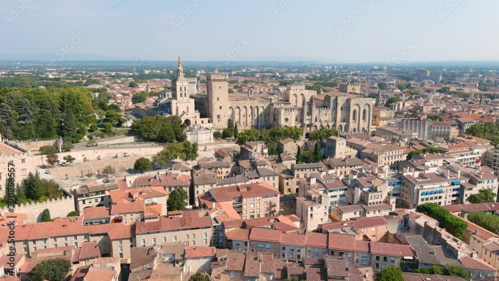 Avignon, France: Aerial view of Palais des Papes (Papal Palace), medieval fortress and former residence of popes in historic city center - landscape panorama of Europe from above Avignon, France: Aerial view of Palais des Papes (Papal Palace), medieval fortress and former residence of popes in historic city center - landscape panorama of Europe from above