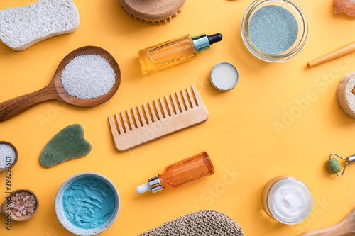 Zero waste self care products with copy space on yellow background. Eco-friendly bathroom beauty products for skin care and body care with blank space on color background