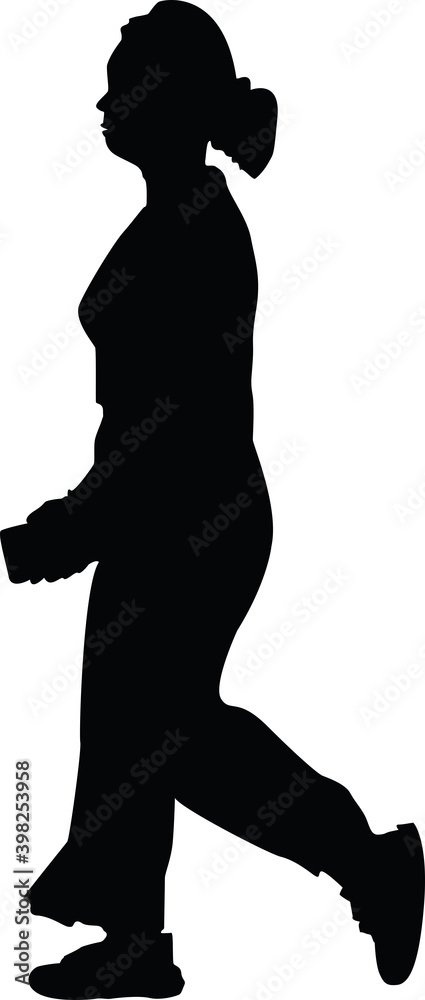 silhouette of woman walking