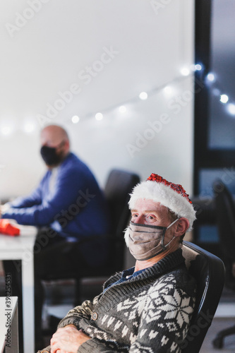 Office worker wearing santa hat