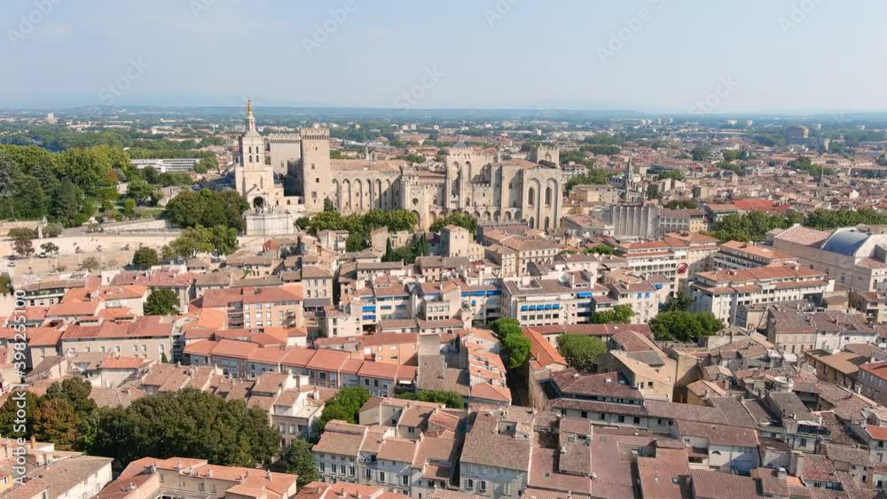 Avignon, France: Aerial view of Palais des Papes (Papal Palace), medieval fortress and former residence of popes in historic city center - landscape panorama of Europe from above Avignon, France: Aerial view of Palais des Papes (Papal Palace), medieval fortress and former residence of popes in historic city center - landscape panorama of Europe from above
