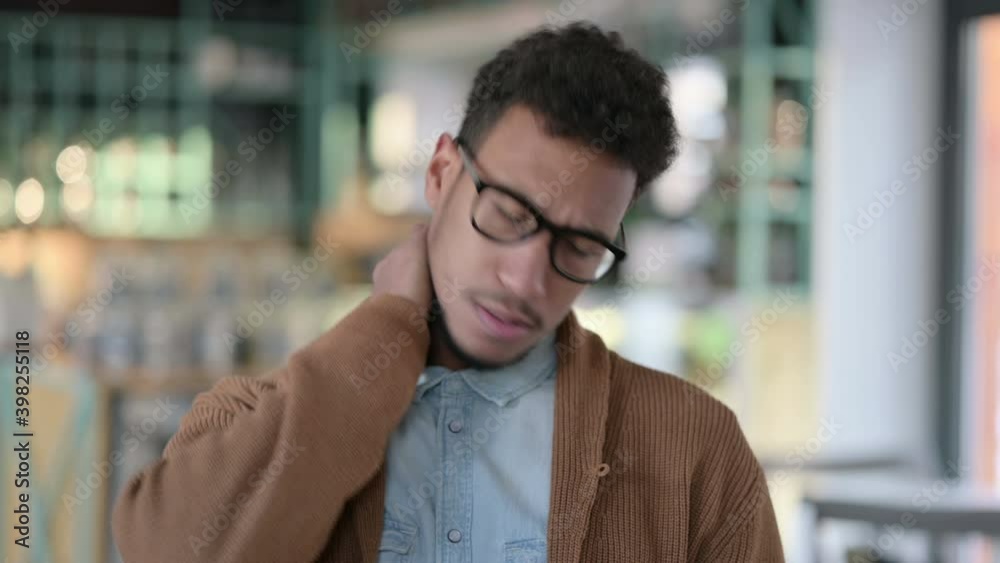 Portrait of Young African Man having Neck Pain