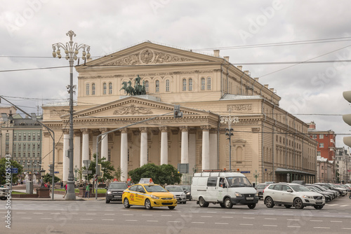 Pedestrians and vehicles moving near the Bolshoi Theatre photo