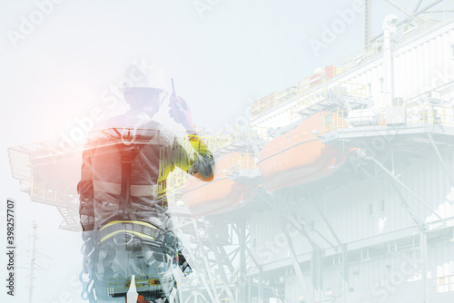 Double exposure workers wearing equipment full safety harness, rope access on oil rig platform background,