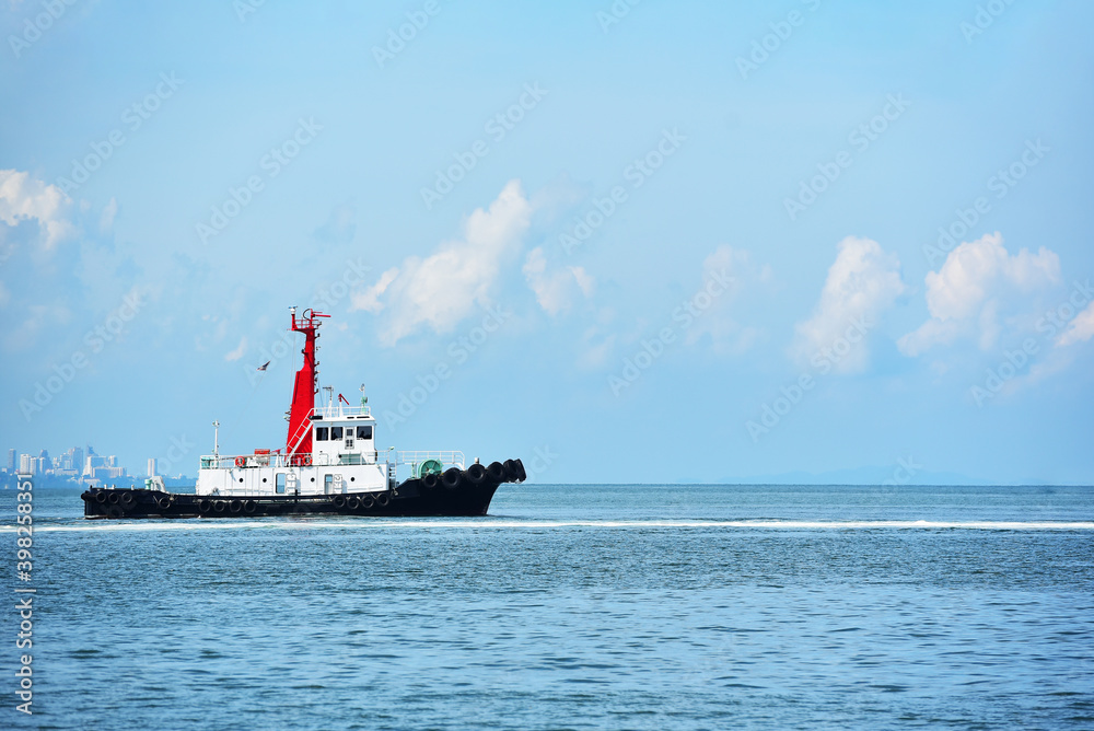 Tug Boat Ready To Help Ships in the blue sea