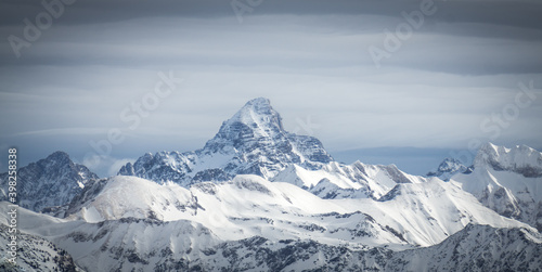 Amazing dramatic Winter panoramic View to the snow covered Mountain Hochvogel in Allgau Alps, Bavaria, Germany.