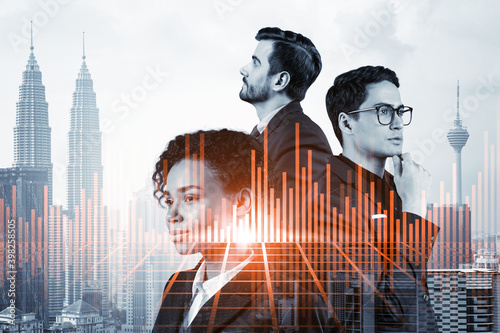 Photography Group of business colleagues in suits as a part of multinational corporate team working on forecasting trading corporate strategy at fund