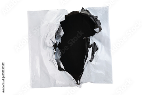 Torn white plastic parcel bag isolated on white background. View from above.