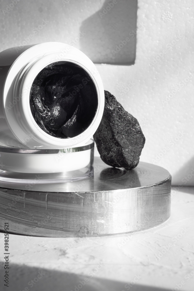 black mask with crub by activated charcoal powder and caviar