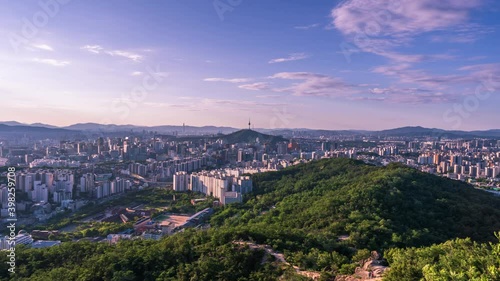 Time lapse 4K Seoul city skyline and Seoul tower modern building and architecture, Beautiful clouds flow through in Seoul, South Korea. photo