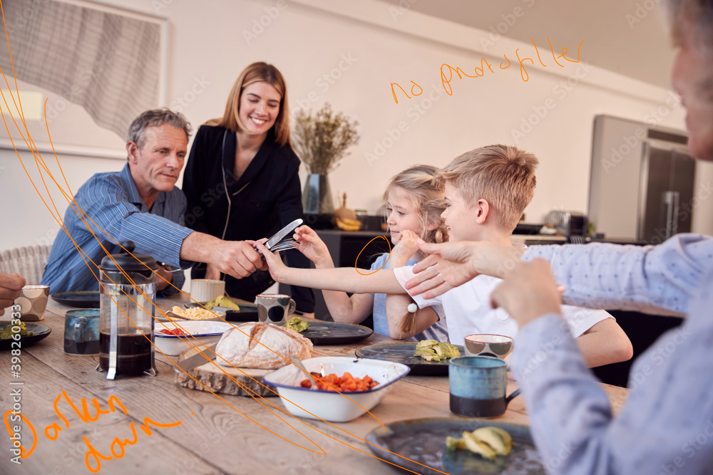 Multi-Generation Family Sitting Around Table At Home In Pyjamas Enjoying Brunch Together Multi-Generation Family Sitting Around Table At Home In Pyjamas Enjoying Brunch Together