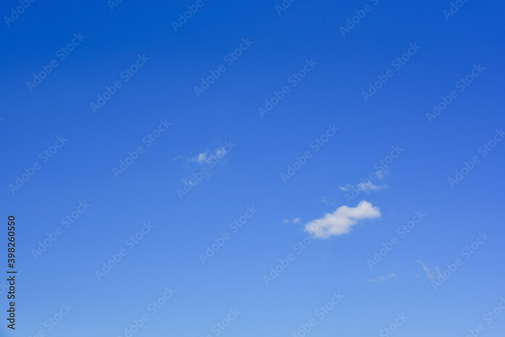 Small, fluffy and lonely clouds in the blue sky. Small, fluffy and lonely clouds in the blue sky.