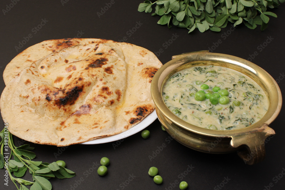 Methi Mutter Malai, Indian food server with naan or tandoori roti ...